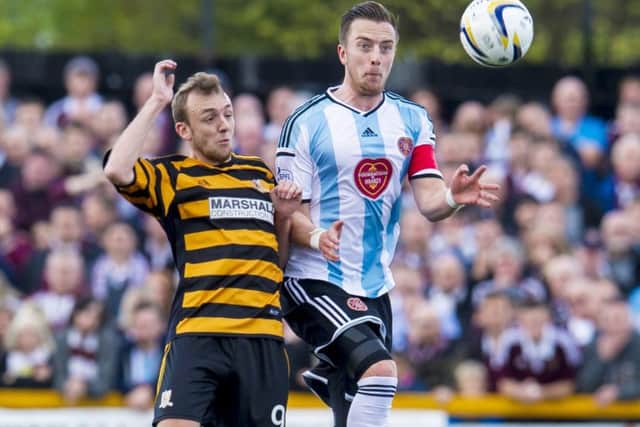Hearts captain Danny Wilson, right, challenges Greig Spence of Alloa. Picture: SNS