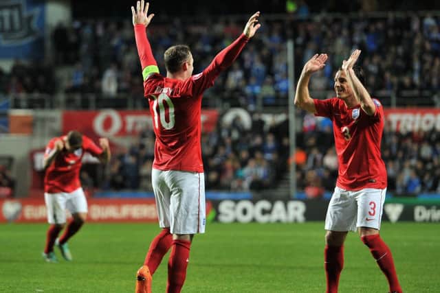 Leighton Baines, right, congratulates Wayne Rooney on his 43rd England goal. Picture: Getty