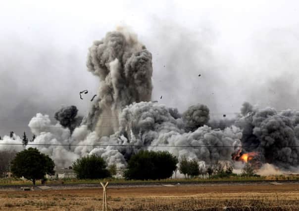Smoke rises from Kobani, seen from near the Mursitpinar border crossing on the Turkish-Syrian border. Picture: Getty
