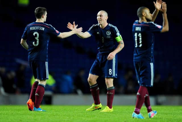 Scotland captain Scott Brown shakes hands with Andrew Robertson after the final whistle against Georgia. Picture: Ian Rutherford