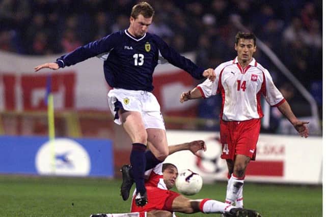 Steven Caldwell battles for the ball in Bydgoszcz on his debut for the national team. Picture: SNS/Jeff Holmes