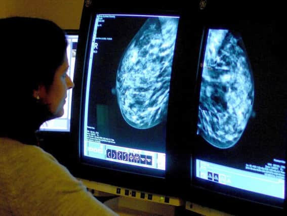 A consultant analyses a mammogram, but Kadcyla won't be used by the NHS in Scotland. Picture: PA