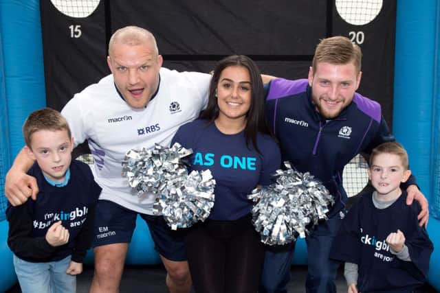 Scotlands Euan Murray (2nd left) and Finn Russell join fans at the St Enoch Centre in Glasgow. Picture: SNS