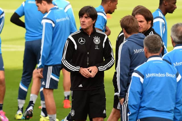 Head coach Joachim Loew talks to the players during a training session in Essen, Germany. Picture: Getty