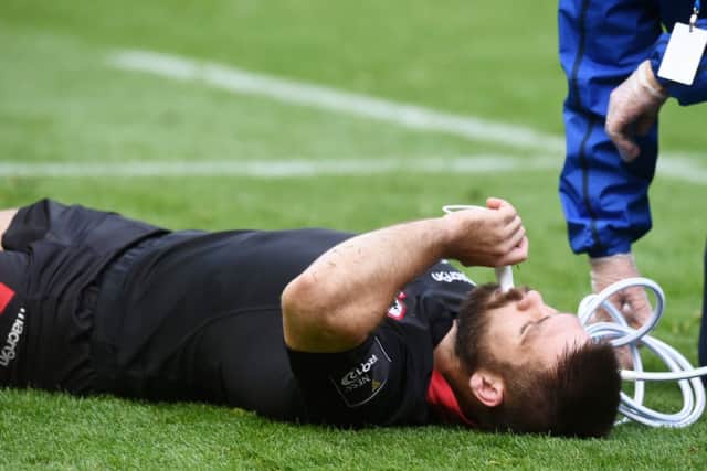 Edinburgh's Cornell Du Preez receives oxygen after picking up an injury. Picture: SNS
