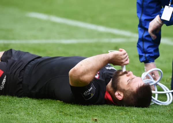 Edinburgh's Cornell Du Preez receives oxygen after picking up an injury. Picture: SNS