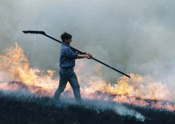 A farmer manages the annual burning of heather on the moors, a traditional method of encouraging regeneration and biodiversity, and safeguarding against wild fires. Picture: Ian Rutherford