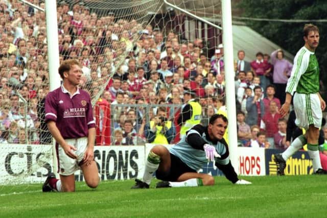 John Burridge reacts after saving an effort from Hearts' Ian Baird, left. Picture: TSPL