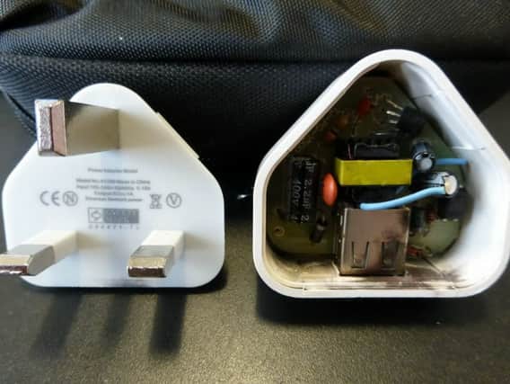 The exploded fake phone charger. Picture: Hemedia