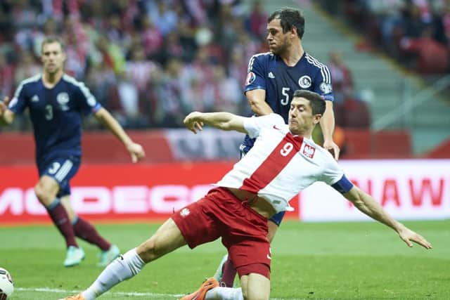 Robert Lewandowski has slammed Scotland's Gordon Greer for what he calls a 'brutal' tackle. Picture: Getty