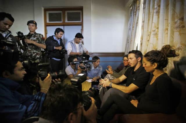 Israeli trekkers, from left, Maya Ora, Yakov Megreli and Linor Kajan speak to the media after being rescued. Picture: Reuters