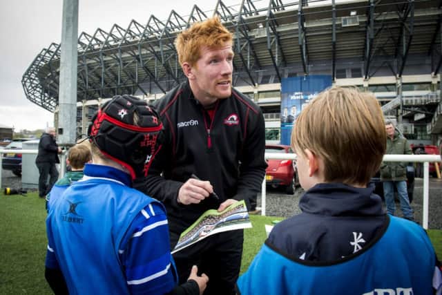 Roddy Grant signs autographs for fans after the Kids Camp training session at Murrayfield. Picture: SNS/SRU