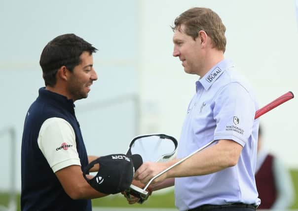 Stephen Gallacher shakes hands with Pablo Larrazabal after the Spaniard had grabbed victory at the last hole. Picture: Getty
