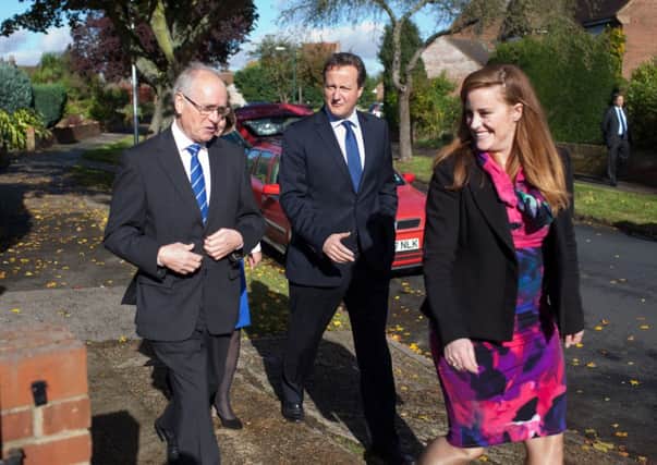 Mr Cameron in Rochester yesterday with Kelly Tolhurst. Picture: Getty