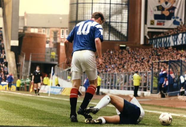 John McStay is grounded after being the victim of a headbutt by Rangers Duncan Ferguson. Picture: Neil Hanna