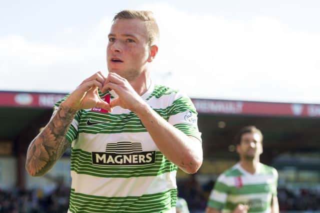 Celtic striker John Guidetti celebrates after scoring the opening goal of the game. Picture: SNS