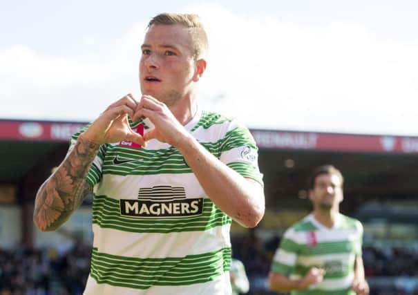 Celtic striker John Guidetti celebrates after scoring the opening goal of the game. Picture: SNS