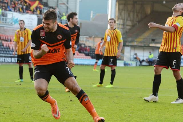 Nadir Ciftci of Dundee Utd celebrates after slotting home his penalty. Picture: SNS