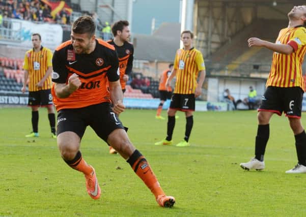 Nadir Ciftci of Dundee Utd celebrates after slotting home his penalty. Picture: SNS