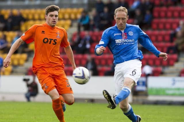 St Johnstone's Steven Anderson (right) clears from Kilmarnock's Robbie Muirhead. Picture: SNS