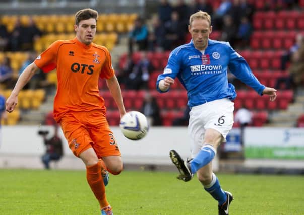 St Johnstone's Steven Anderson (right) clears from Kilmarnock's Robbie Muirhead. Picture: SNS