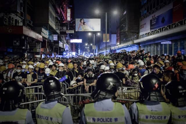 Thousands of pro-democracy protesters face down police amid violent clashes in Hong Kong over the weekend. Picture: Getty