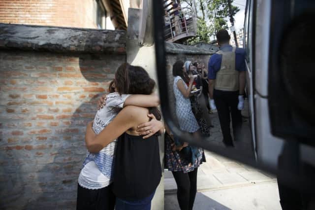 Israeli survivors from the blizzard hug each other, as they get ready to board a bus to the airport. Picture: Reuters