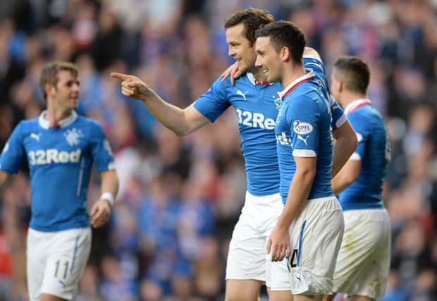 Rangers striker Jon Daly, left, celebrates the first of his two goals against Raith. Picture: SNS