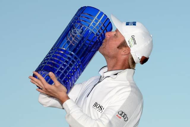 Mikko Ilonen celebrates with the trophy after victory at The London Club. Picture: Ross Kinnaird/Getty Images
