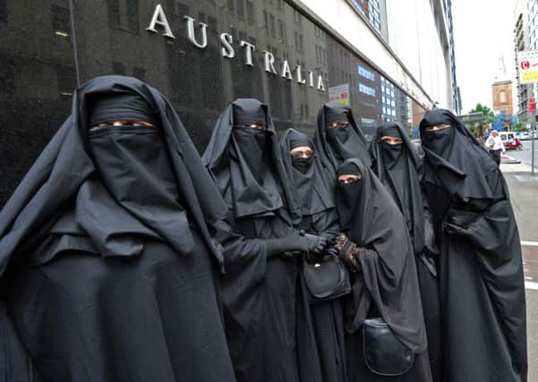 Visitors wearing face coverings will now have to identify themselves at a security check point. Picture: Getty