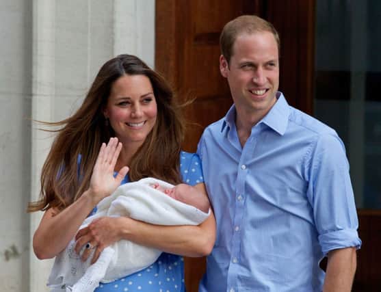 The Duke and Duchess of Cambridge with first child George in 2013. Picture: AFP