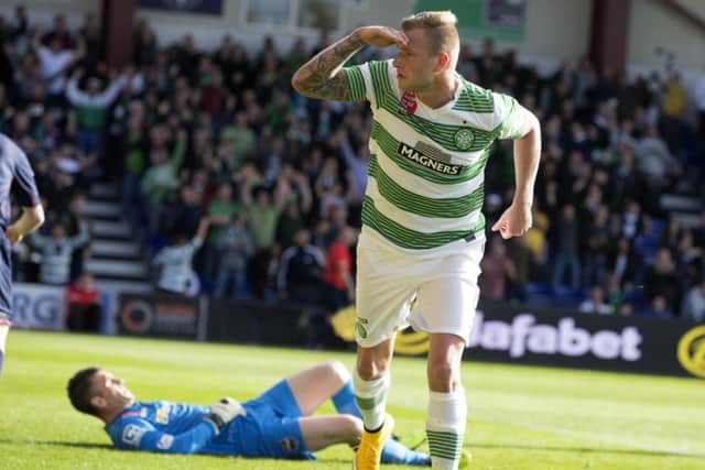 Celtic's John Guidetti celebrates after scoring the opening goal against Ross County. Picture: PA