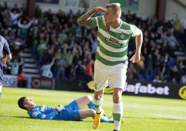 Celtic's John Guidetti celebrates after scoring the opening goal against Ross County. Picture: PA