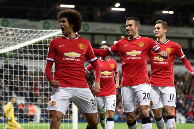 Substitute Marouane Fellaini shows his delight after scoring his first goal for Manchester United last night. Picture: PA