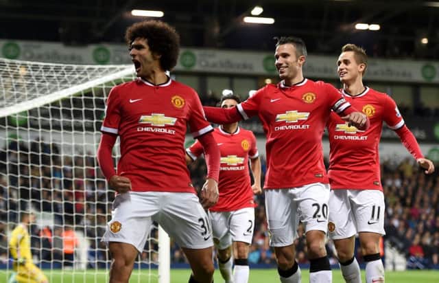 Substitute Marouane Fellaini shows his delight after scoring his first goal for Manchester United last night. Picture: PA