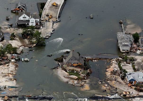 Ford's characters witness the trail of destruction left by Hurricane Sandy in New Jersey, in October 2012. Picture: Getty