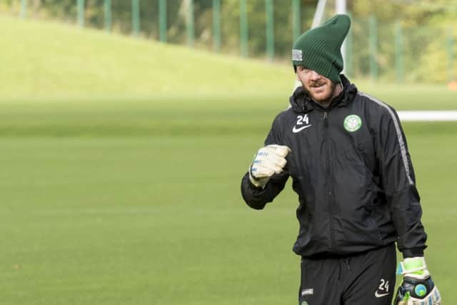 Celtic keeper Lukasz Zaluska covers part of his face as he returned to training yesterday. Picture: SNS