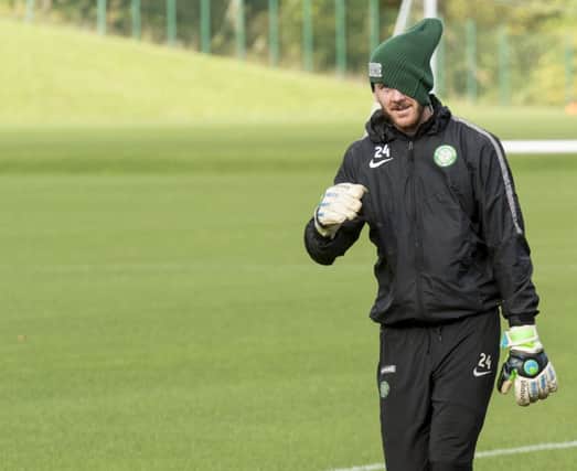 Celtic keeper Lukasz Zaluska covers part of his face as he returned to training yesterday. Picture: SNS