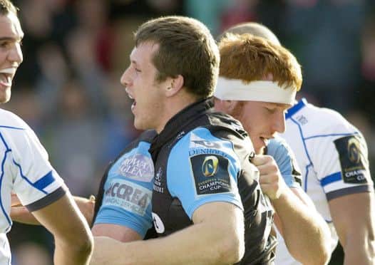 Mark Bennett celebrates one of his two tries against Bath with team-mate Rob Harley. Picture: SNS/SRU