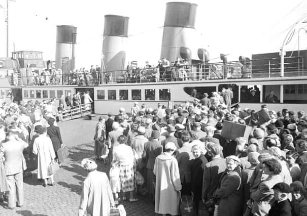 Hundreds of holiday makers prepare to board a Clyde Steamer during the Glasgow Fair. Picture: TSPL