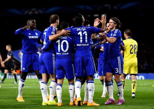 Eden Hazard is congratulated by teammates after his cross is deflected for an own goal by Mitja Viler of Maribor. Picture: Getty