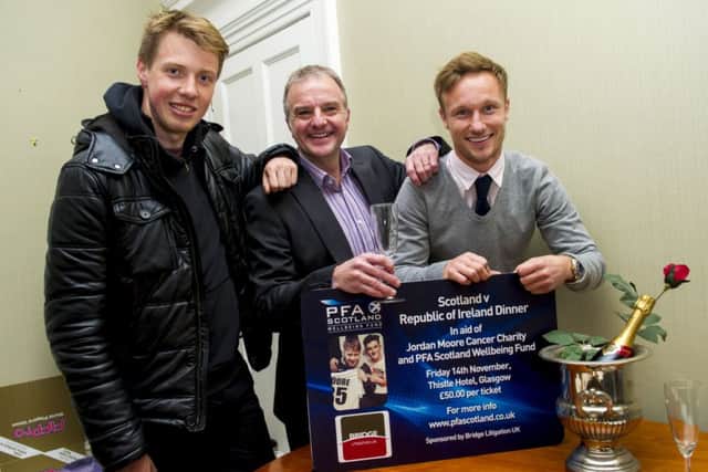 Jordan Moore, left, joins Fraser Wishart, centre, and Iain Russell, right, at the launch of the PFA Scotland Wellbeing Fund. Picture: SNS