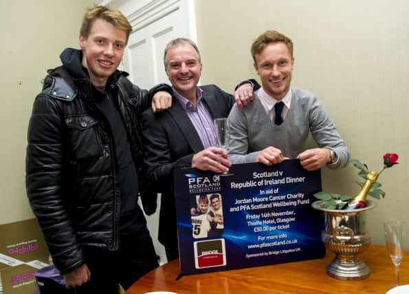 Jordan Moore, left, joins Fraser Wishart, centre, and Iain Russell, right, at the launch of the PFA Scotland Wellbeing Fund. Picture: SNS