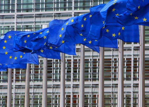 European Union flags are seen outside the European Commission headquarters in Brussels. Picture: Reuters