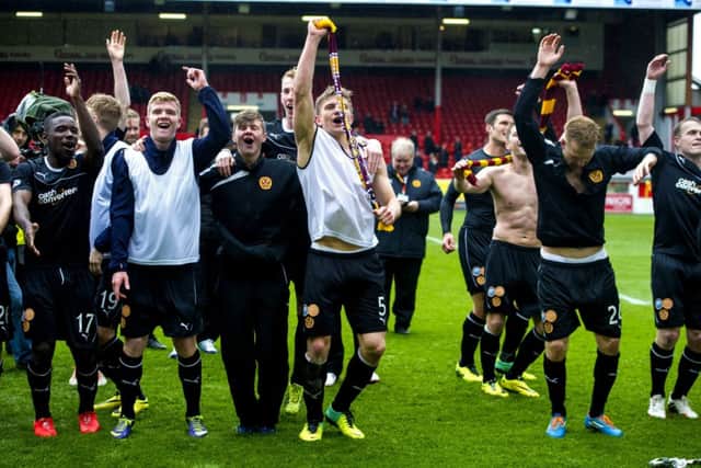 Motherwell players celebrate clinching second place with victory at Pittodrie on the seasons final day last May. Picture: SNS