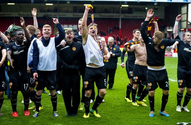 Motherwell players celebrate clinching second place with victory at Pittodrie on the seasons final day last May. Picture: SNS