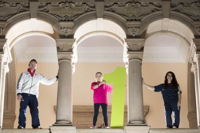 Dan Purvis and Claudia Fragapane at Kelvingrove Art Gallery with local youngster Kacey Morrison. Picture: PA