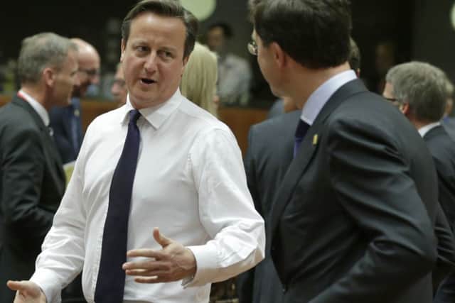 Prime Minister David Cameron, left, speaks with Dutch Prime Minister Mark Rutte. Picture: AP