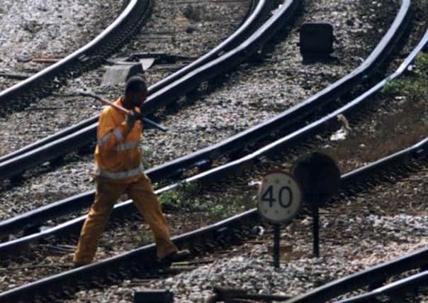 Nine rail workers were nearly run over by an 80mph train that arrived without warning. Picture: Reuters