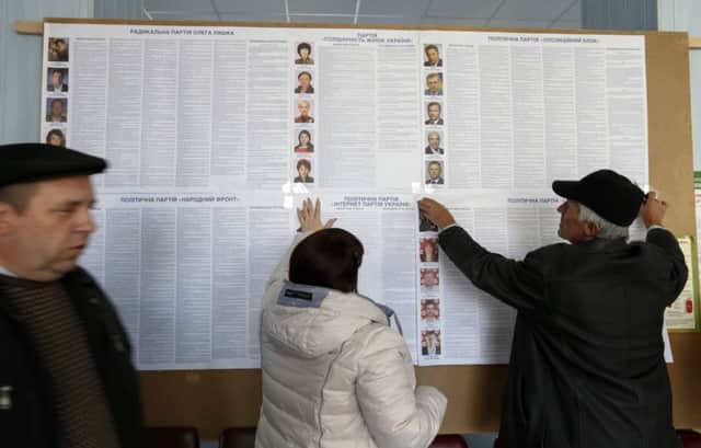 Election officials prepare for the vote in Slovyansk, formerly rebel-held. Picture: Reuters